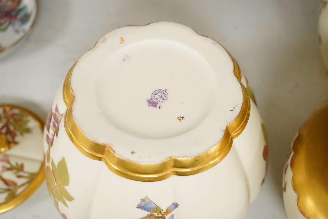 Three 19th century Worcester blush ivory potpourri or biscuit jars and covers, two with liners, each decorated with flowers and buds, largest 20cm high